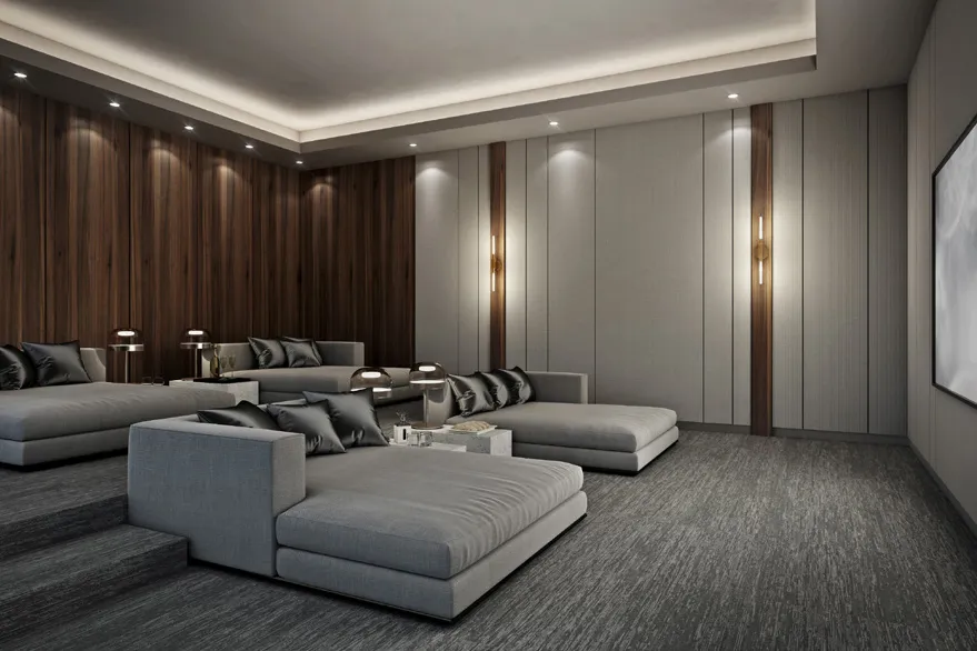 Cinema room with deep grey sofas and walnut-panelled walls